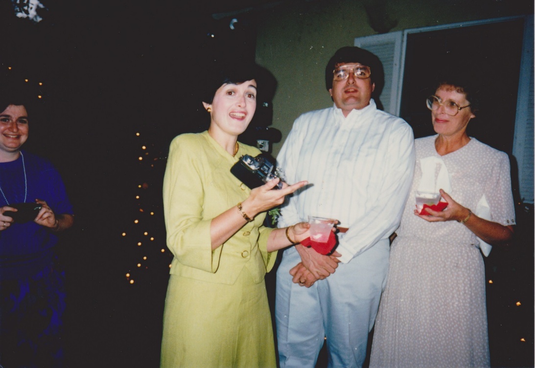 Leslie, Suzy in Shirley's dress, and Tom